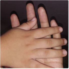 mother-and-child-holding-hands