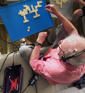anti-aging-senior-during-a-neurofeedback-at-home-session-playing-scrabble-small-size