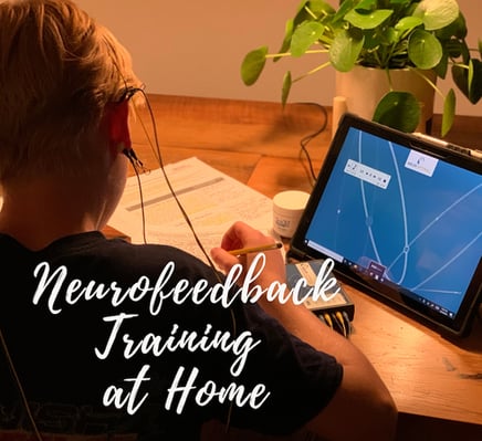 neurofeedback-training-at-home-child-doing-homework-while-in-session-at-home