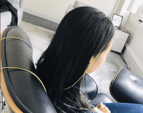eeg sensors attached to scalp and ears neurofeedback training session in nyc office