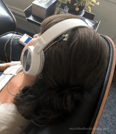 woman listening to music during neuroptimal session