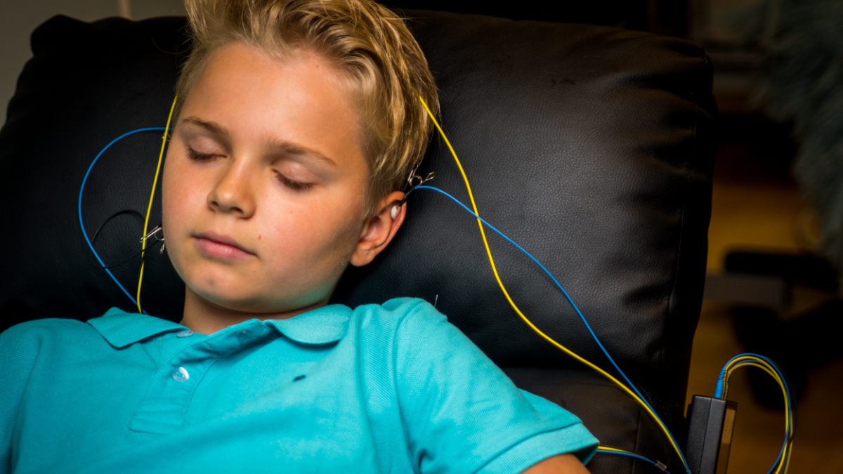 boy sleeping during neuroptimal home session