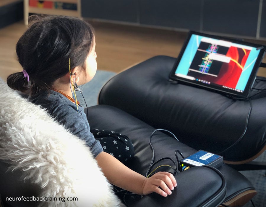 neurofeedback-training-child-doing-a-neuroptimal-session-at-home neurofeedback-training-child-doing-a-neuroptimal-session-at-home